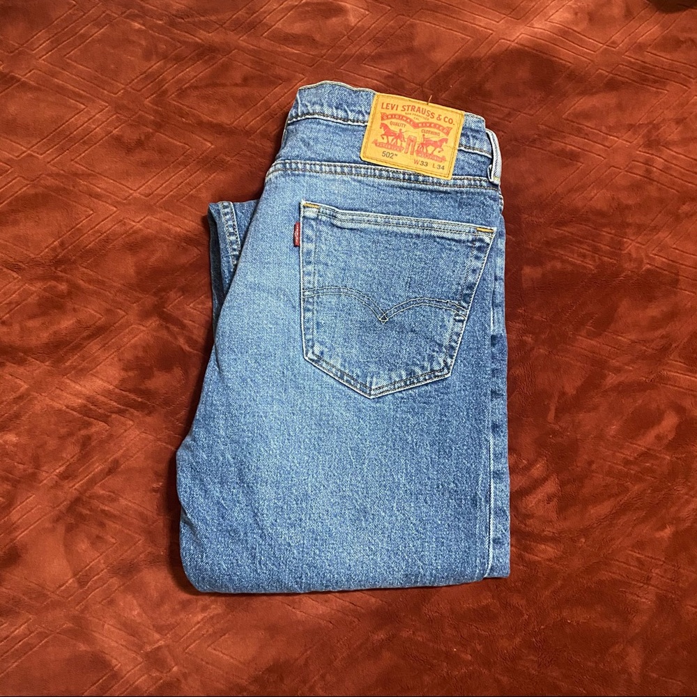 Levi 502 medium wash denim jeans